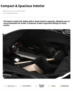 Vertical view showing the spacious interior of a black leather tote with daily essentials
