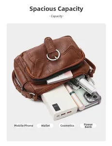 Detailed interior view of a brown multi-pocket crossbody bag showing large storage capacity