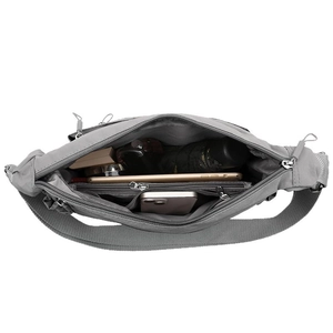 Large capacity nylon crossbody bag with multiple compartments showing organized interior