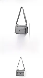 Tableau des tailles détaillé pour sac bandoulière en nylon gris de 26x10x18 cm