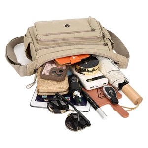 Khaki nylon crossbody bag with multi-layer zippers showing high capacity storage
