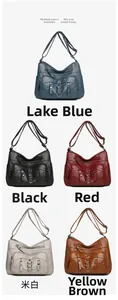 Detail view of washed PU leather crossbody bag showing multiple pockets and five colors