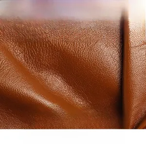 Macro shot of brown pebble-grain leather showing soft texture and scratch resistance
