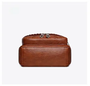 Detail view of the brown lychee pattern leather bag bottom with high-quality stitching