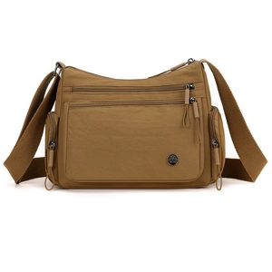Brown oxford fabric crossbody bag with multiple zip pockets and adjustable strap