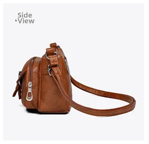 Side view of brown multi-pocket crossbody bag with zipper and tassel details