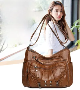 Brown soft PU leather crossbody bag featuring multi-zipper pockets and waterproof material