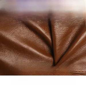 Close-up of soft brown leather texture showing scratch-resistant and breathable material