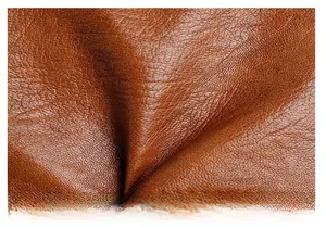 Detailed macro view of premium brown leather texture with neat stitching craftsmanship