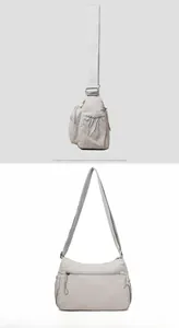 Detailed back and side view of waterproof nylon crossbody bag with multi-zipper pockets