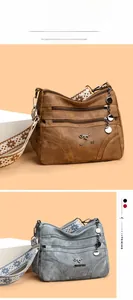 Detail of multi-layer tote bags in brown and blue with ethnic style woven wide straps