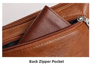 Detail view of the back zipper pocket on the caramel brown pebbled leather handbag