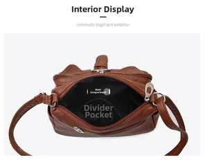 Internal view of brown leather bag showing spacious main compartment and zipper divider