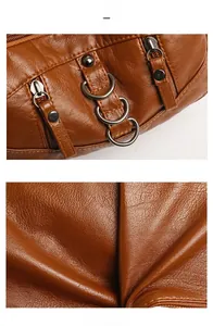 Detail view of brown lychee grain leather texture with premium metal hardware and rivets
