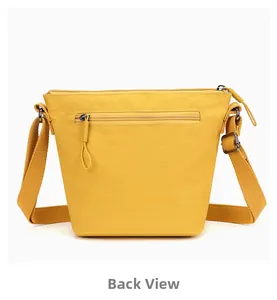 Rear view of bright yellow nylon bucket bag showing back zipper pocket and wide strap