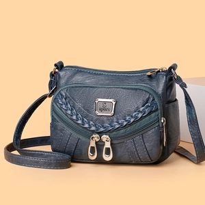 Fashionable dark blue soft leather crossbody bag with multiple pockets and woven detail