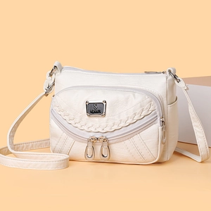 Chic off-white faux leather crossbody bag with multiple zippers and litchi texture