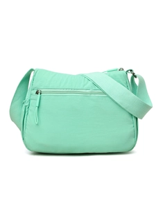 Detail of mint green waterproof nylon crossbody bag with wide strap and zipper pocket
