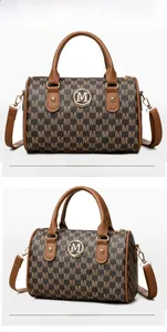 Front and side view of a vintage Boston bag with M-pattern print and gold logo