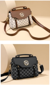 Detail of vintage tote bags with monogram pattern and gold M buckle in multiple colors