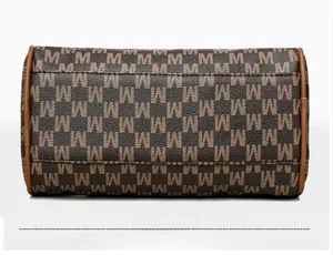 Close-up of the vintage M-pattern printed base with reinforced brown piping and neat stitching