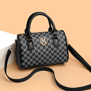 Vintage monogram Boston handbag with M-pattern and black leather trim for women