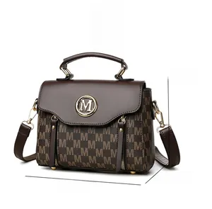 Detailed view of dark brown PU handbag with 'M' pattern and 20x15x10cm size guide