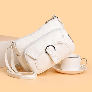 Minimalist beige PU leather multi-pocket crossbody bag with adjustable strap and metal ring