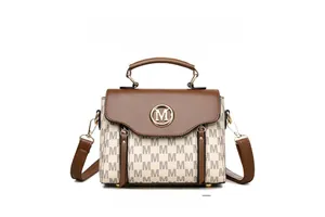 Detail of white handbag with M-pattern print, brown flap, and round metal logo buckle