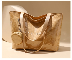 Detail of waterproof PVC tote bag with brown DuPont paper texture and small round purse