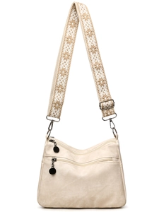 Minimalist beige tote bag with wide geometric pattern strap and silver metal zipper detail