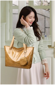 Detail of light brown waterproof paper tote bag featuring white TOTE BAG text print