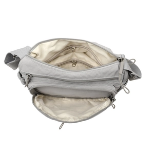 Grey water-resistant nylon crossbody bag with multi-layer zipper pockets for women