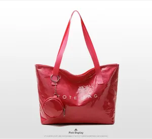 Pink waterproof tote bag with shiny crinkled texture and round mini coin purse detail