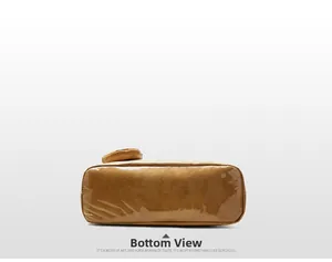 Detail view of the flat wide bottom and neat stitching on the brown waterproof tote bag