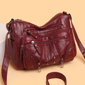 Deep wine red multi-pocket shoulder bag in textured soft leather with woven details