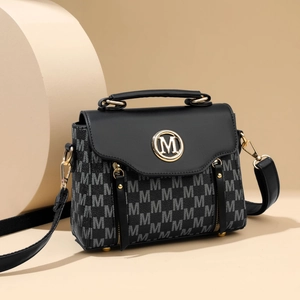 Classic black and monogram leather handbag with gold M logo and detachable shoulder strap