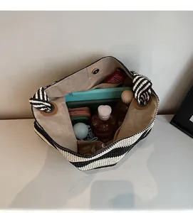 Detailed interior of striped woven tote bag showing large capacity for essentials