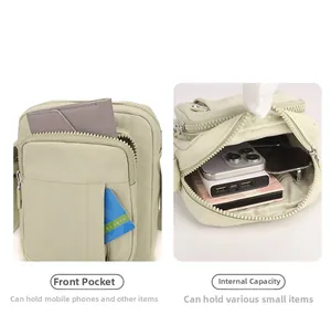 Detailed interior and exterior pockets of green canvas messenger bag showing large capacity