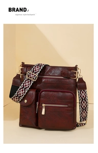 Detailed view of brown faux leather backpack with colorful ethnic woven strap