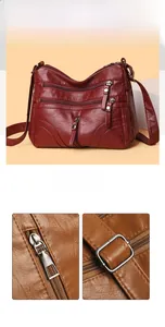 Macro shot of retro leather texture and multi-zipper compartments on a crossbody bag