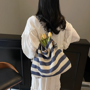 Blue and white striped woven straw beach tote bag with large capacity for travel