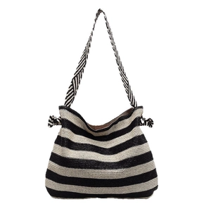 Striped straw beach tote bag with black and white woven texture for summer vacation