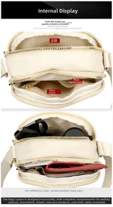 Internal view of a multi-layer beige nylon crossbody bag with several compartments