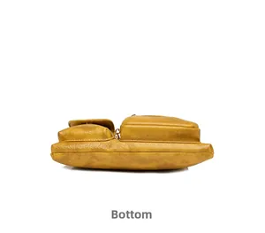 Bottom view of mustard yellow faux leather crossbody bag with vintage wrinkled texture