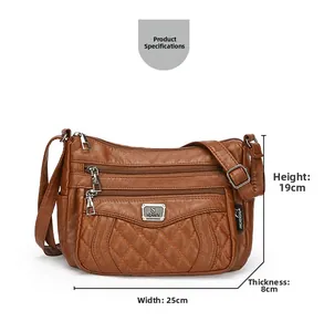 Detail of brown quilted crossbody bag with triple zippers and 25x19x8cm dimensions