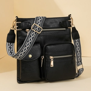 Minimalist black PU leather crossbody bag with multiple zip pockets and ethnic woven strap