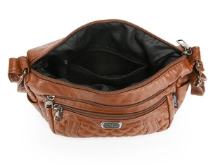 Macro detail of brown quilted PU leather bag with multi-pocket zipper compartments
