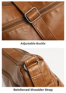 Close-up of adjustable metal buckle and reinforced stitching on brown leather handbag