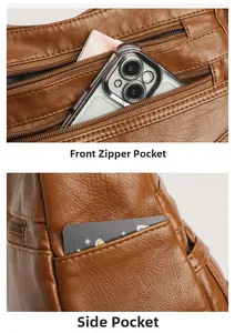 Detail view of the brown leather crossbody bag showing front zipper and side storage pockets